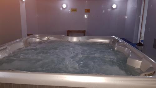 a bath tub filled with water in a bathroom at Apartamento Amoblado Ciudad Salitre Bogotá in Bogotá