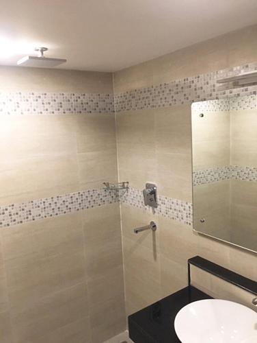 a bathroom with a shower and a sink at ViaVia Boutique Hotel - Kathmandu in Kathmandu