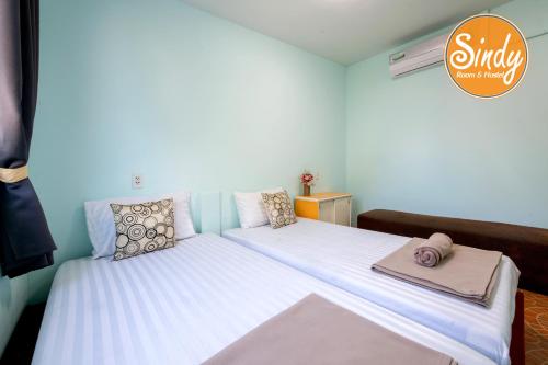 מיטה או מיטות בחדר ב-Sindy Rooms