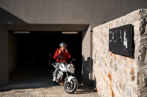 a person riding a motorcycle out of a tunnel at Calva B&B Apartments in Malles Venosta