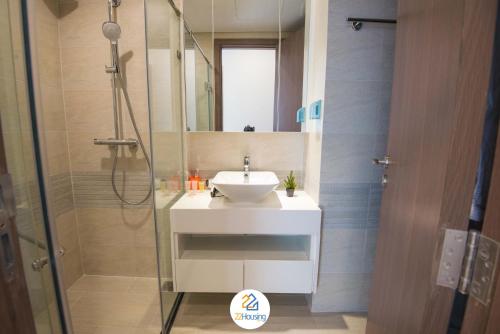 a bathroom with a sink and a shower at Vinhomes Metropolis luxury Hotel & Residence in Hanoi