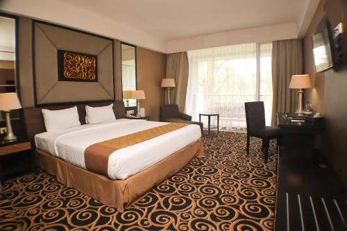 Cama o camas de una habitación en Bela International Hotel & ConventionTernate