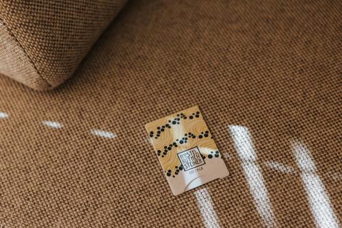 a tag on the floor of a couch at Vienna Hostel Ruthensteiner in Vienna
