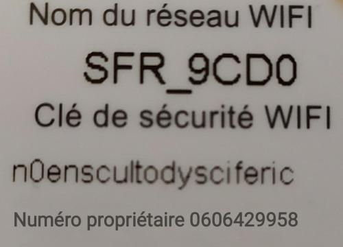 a sign with the writing on the side of a building at Le Minervois in Carcassonne