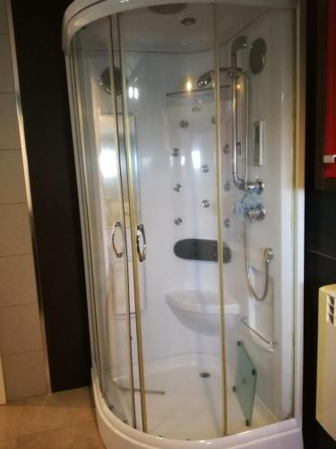 a glass shower with a sink in a bathroom at Quinta Rural - Nossa Sra do Carmo. Teixoso in Teixoso