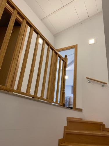 a staircase in a building with a window and some stairs at APARTAMENTS IMPRO in Móra d'Ebre