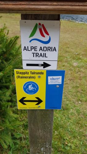 a sign attached to a pole with a sign on it at Houghton Haus in Mallnitz