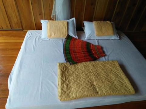 Postel nebo postele na pokoji v ubytování Tran Xuan Homestay