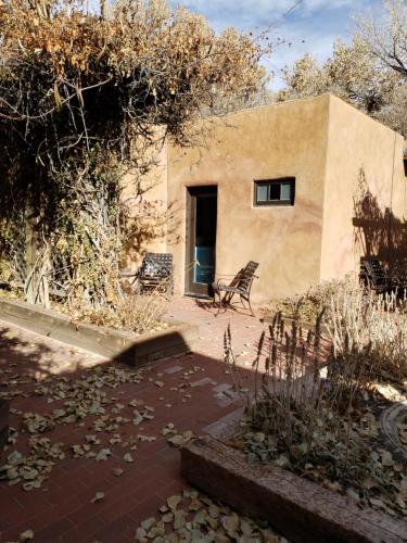a building with a bench in front of it at Abiquiu Inn in Abiquiu
