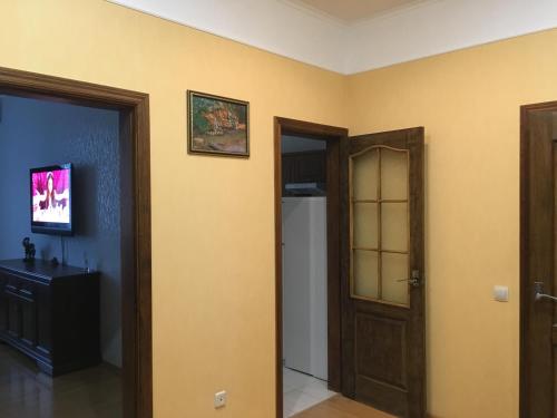 a room with yellow walls and an open door at Comfortable apartment on the Obolon in Kyiv