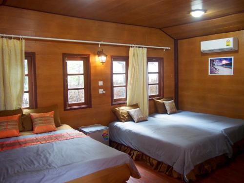 Postel nebo postele na pokoji v ubytování Coco Beach Bungalows