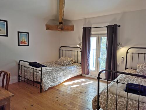 Tempat tidur dalam kamar di Maison d' Alys entre Luberon et Alpilles