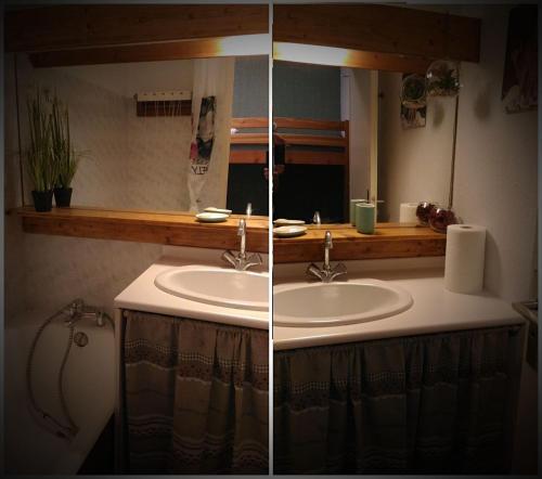 un baño con lavabo y espejo en Les 3 marmottes- le Solaret, en Bourg-Saint-Maurice