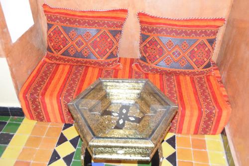 a vase sitting on top of a tiled floor at Kasbah Assafar in Kalaat MGouna