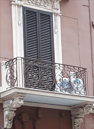 a balcony of a building with a window at Alba Ionica Taranto in Taranto
