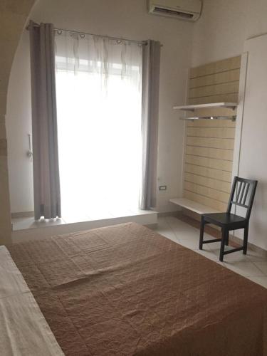 Postel nebo postele na pokoji v ubytování Le stanze di Cortès