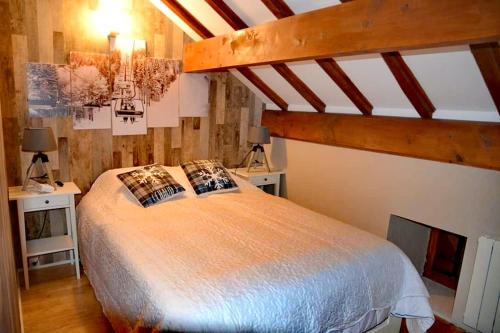 Ένα ή περισσότερα κρεβάτια σε δωμάτιο στο Montagne Ski Porté Puymorens GÎTE