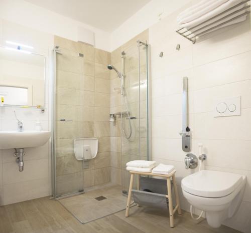 a bathroom with a shower and a toilet and a sink at 8 Grappoli Agritur in Trento