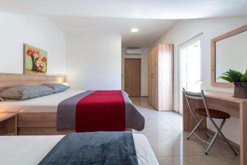 Postel nebo postele na pokoji v ubytování Villa Adriatic Rooms