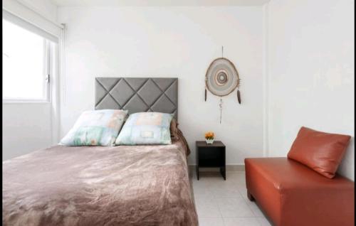 a bedroom with a bed and a chair at Pennsylvania WTC High End 1parking/2BR/2BA in Mexico City