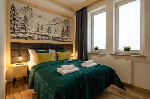Katil atau katil-katil dalam bilik di Villa Granit Zakopane Centrum