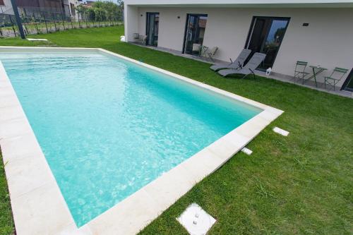 a swimming pool in the yard of a house at Aqua&Co Bellagio - Eco conscious stay in Bellagio