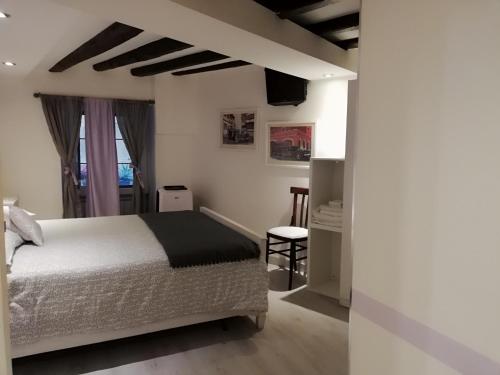 Postel nebo postele na pokoji v ubytování Palazzo Sant'Elia