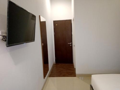 TV a/nebo společenská místnost v ubytování Alzara Hotel Syariah