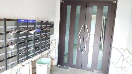 a door in a room with some lockers at Near Nakajima park Close to Susukino Anbiennte 101 in Sapporo
