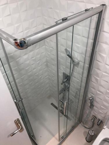 a shower with a glass door in a bathroom at Taksim home in Istanbul