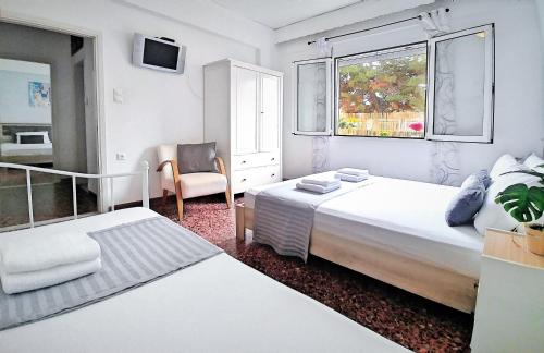 Katil atau katil-katil dalam bilik di Holiday House Heraklion