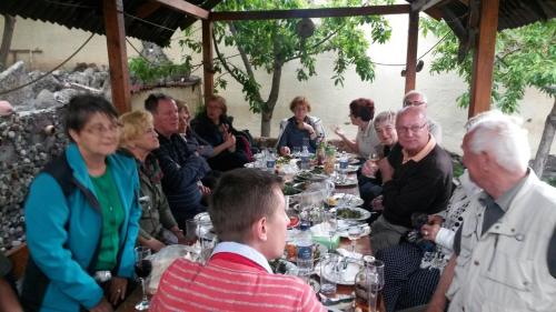 a group of people sitting around a long table at Popock City Center in Yerevan