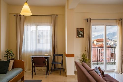a living room with a couch and a table at 2 Bedrooms-Perfect Center Location-Amazing View in Ioannina