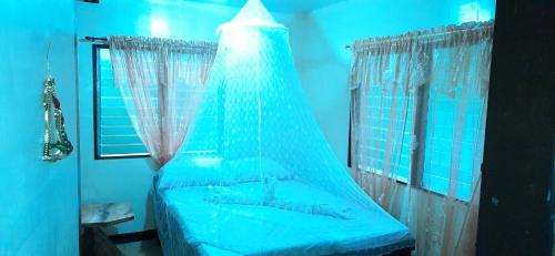 Ένα ή περισσότερα κρεβάτια σε δωμάτιο στο home stay rizalina