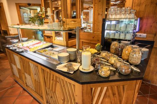 a buffet of food on a counter in a kitchen at HELDs Vitalhotel in Ruhpolding