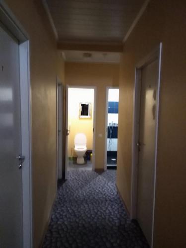 a hallway of a hotel room with a toilet at Hostel31 in Tallinn