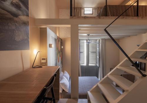 a room with a loft bed and a staircase at Casa Mespilea in Paphos City