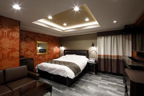 Postel nebo postele na pokoji v ubytování HOTEL Birthday 楠店