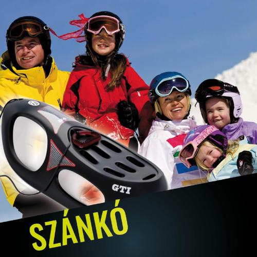 a group of people posing for a picture with a snowboard at 4 Évszak Hegyihotel in Mátraháza