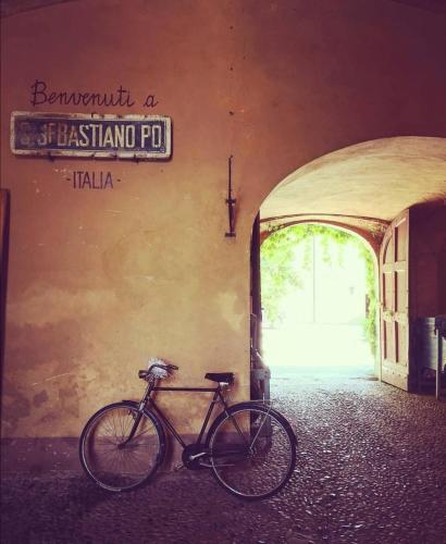 a bike parked on the side of a building at Castello Di San Sebastiano Po in Chivasso