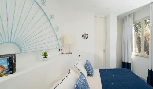 Ένα ή περισσότερα κρεβάτια σε δωμάτιο στο Luxury Villas Positano