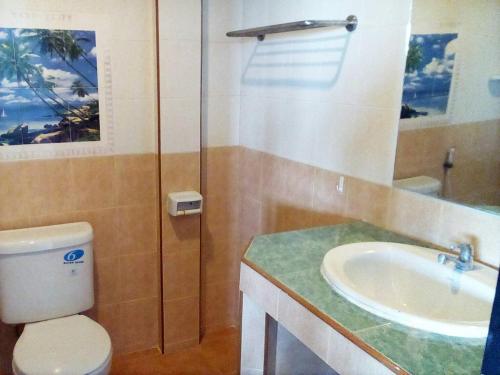 a bathroom with a toilet and a sink at Phangan Island in Ban Tai
