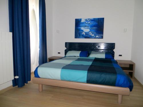 Ένα ή περισσότερα κρεβάτια σε δωμάτιο στο Agriturismo G.GARTROZ