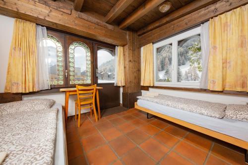 Postel nebo postele na pokoji v ubytování Haus Boccalino