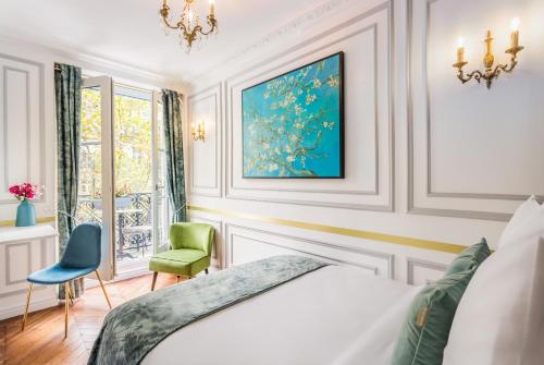 a bedroom with a bed and a chair and a window at Luxury 2 Bedroom With Balcony - Louvre & Notre Dame in Paris