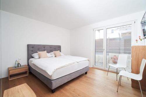Un pat sau paturi într-o cameră la Loft Rebhalde
