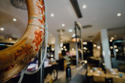 a banana hanging from a pole in a restaurant at Mercure Hotel Hamburg City in Hamburg