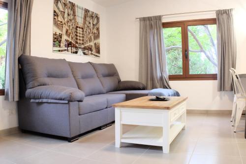 a living room with a couch and a table at Apartamentos Finca Wapa in Frontera