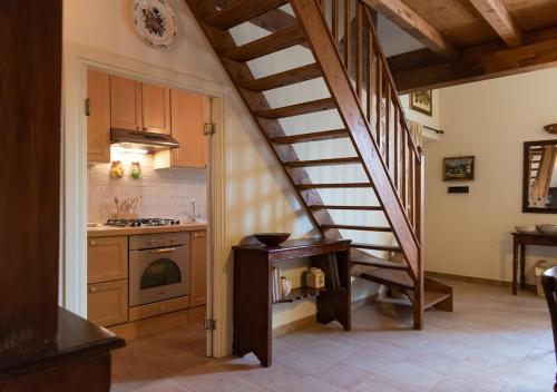 a kitchen with a spiral staircase in a house at Marbel Gandolfo in Castel Gandolfo