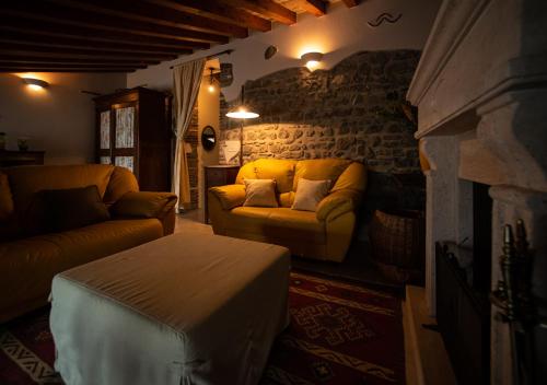 a living room with a couch and a fireplace at Marbel Gandolfo in Castel Gandolfo